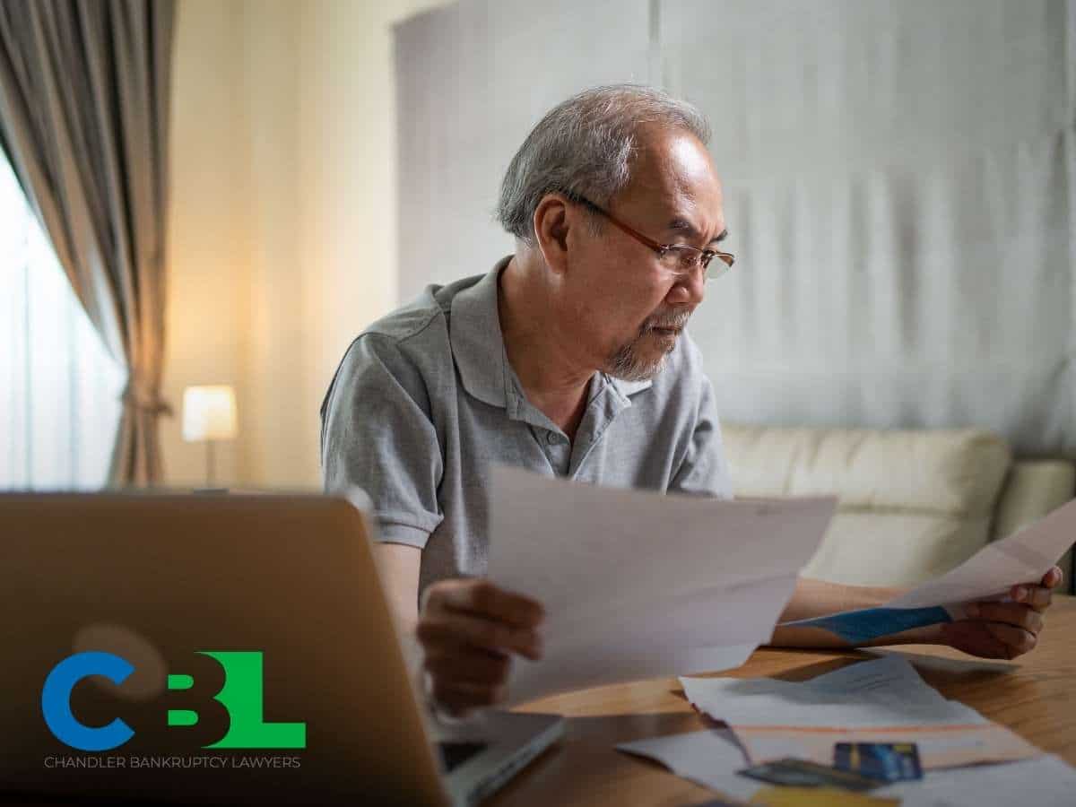 Preocupied Man Deciding If Filing For Bankruptcy Or Using His Retirement Savings In Chandler, AZ